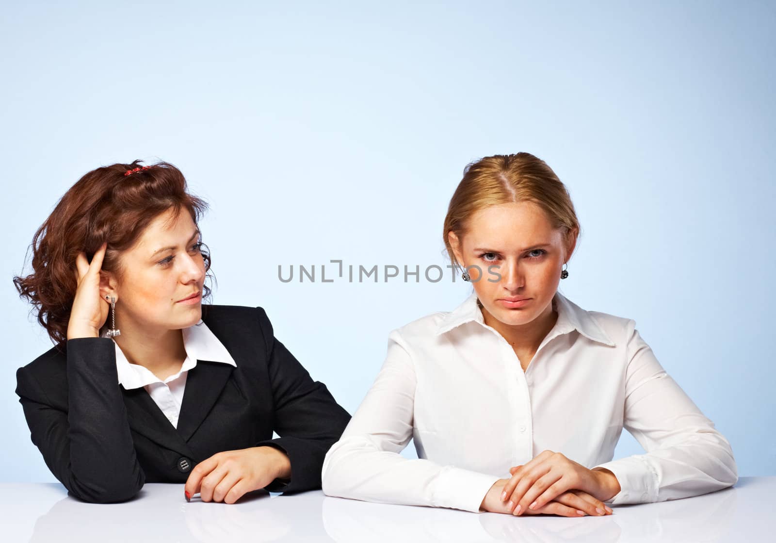 Pretty confident business women against light background