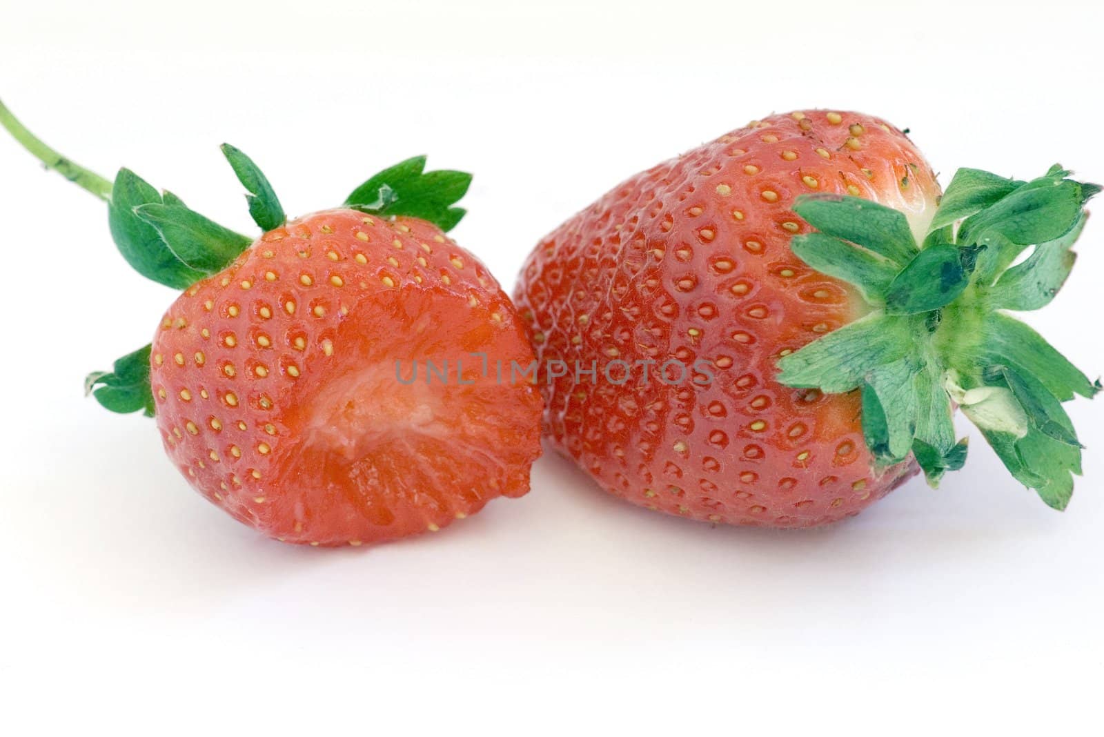 Healthy red strawberry fruit sliced and isolated on white background

