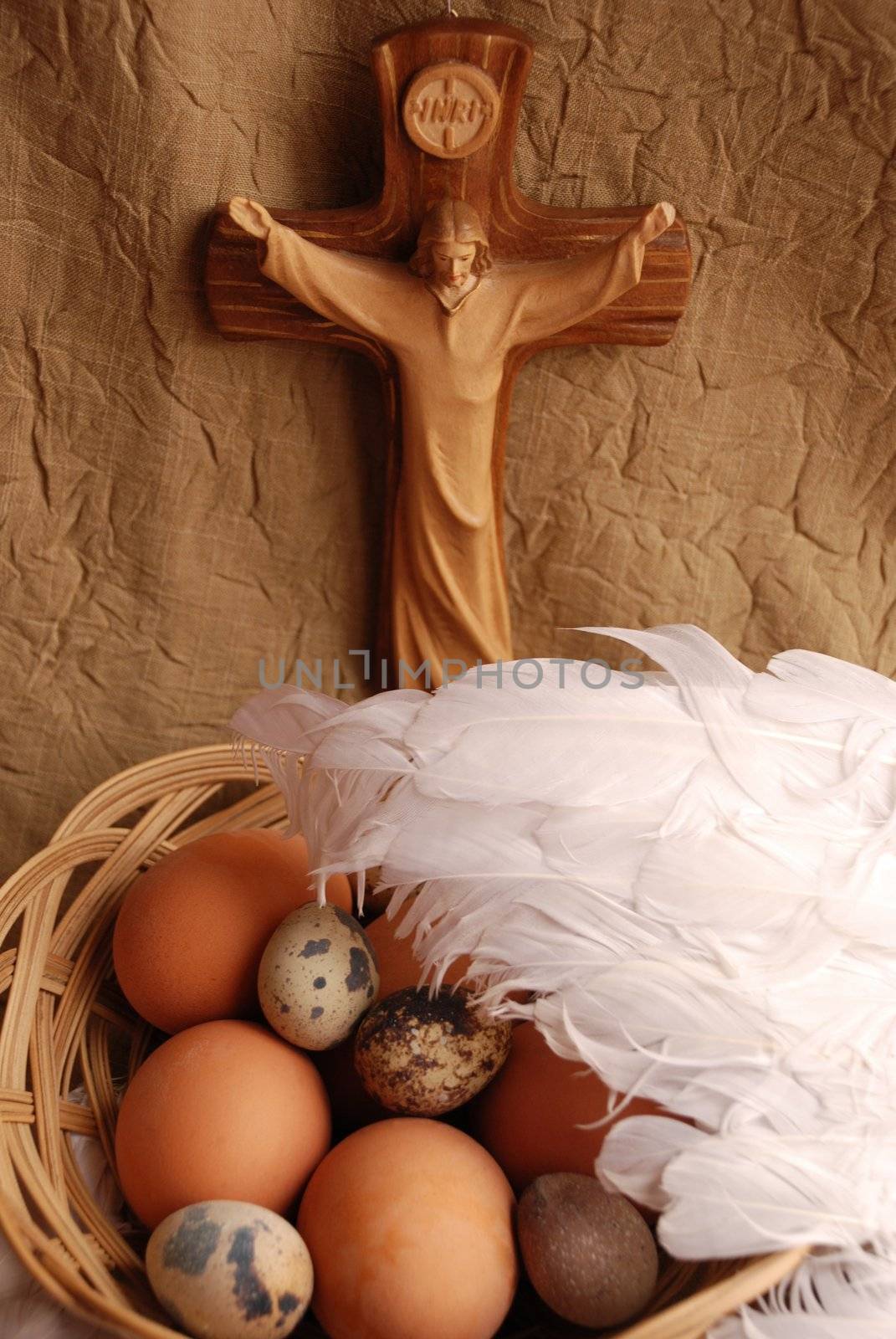 Easter eggs, wings and crucifixion close up