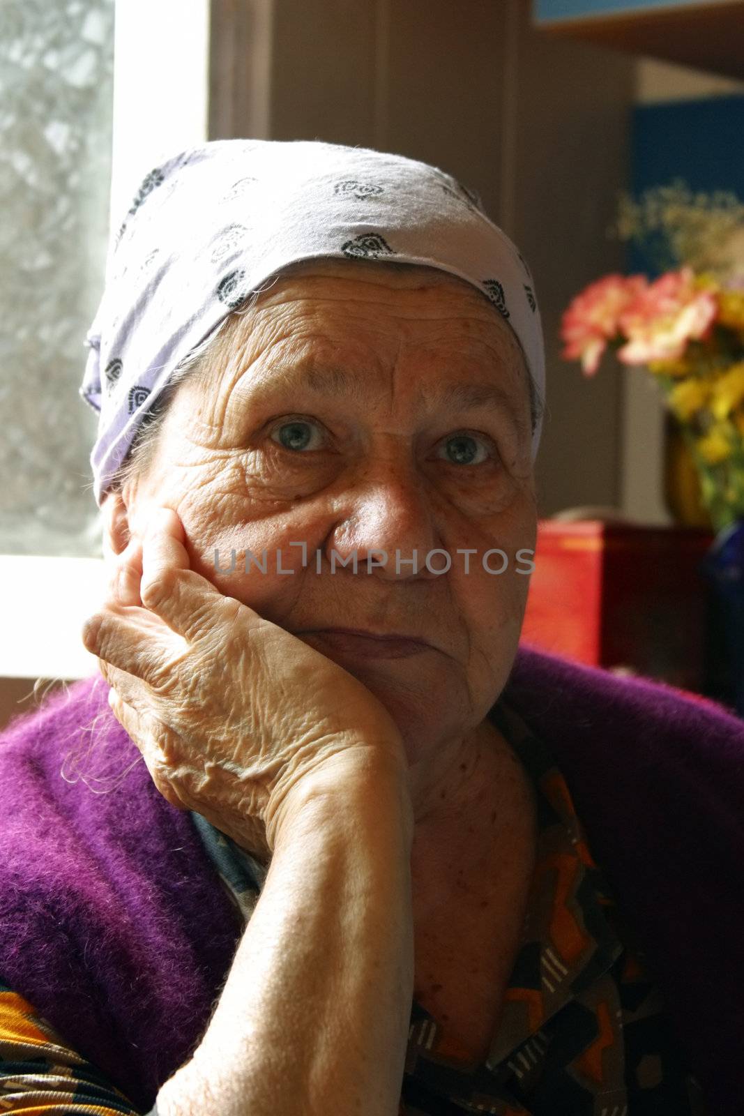 Portrait of the grandmother. Woman in her eighties.