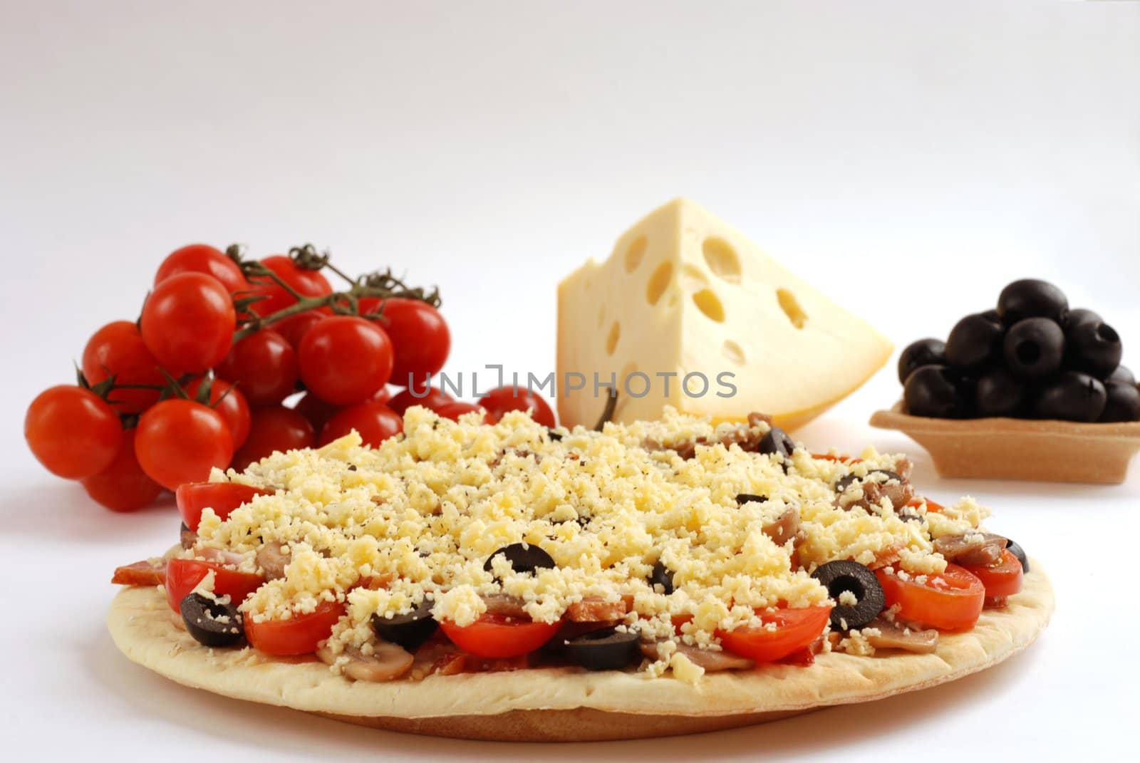 Close up at italian pizza with tomatoes and olive.