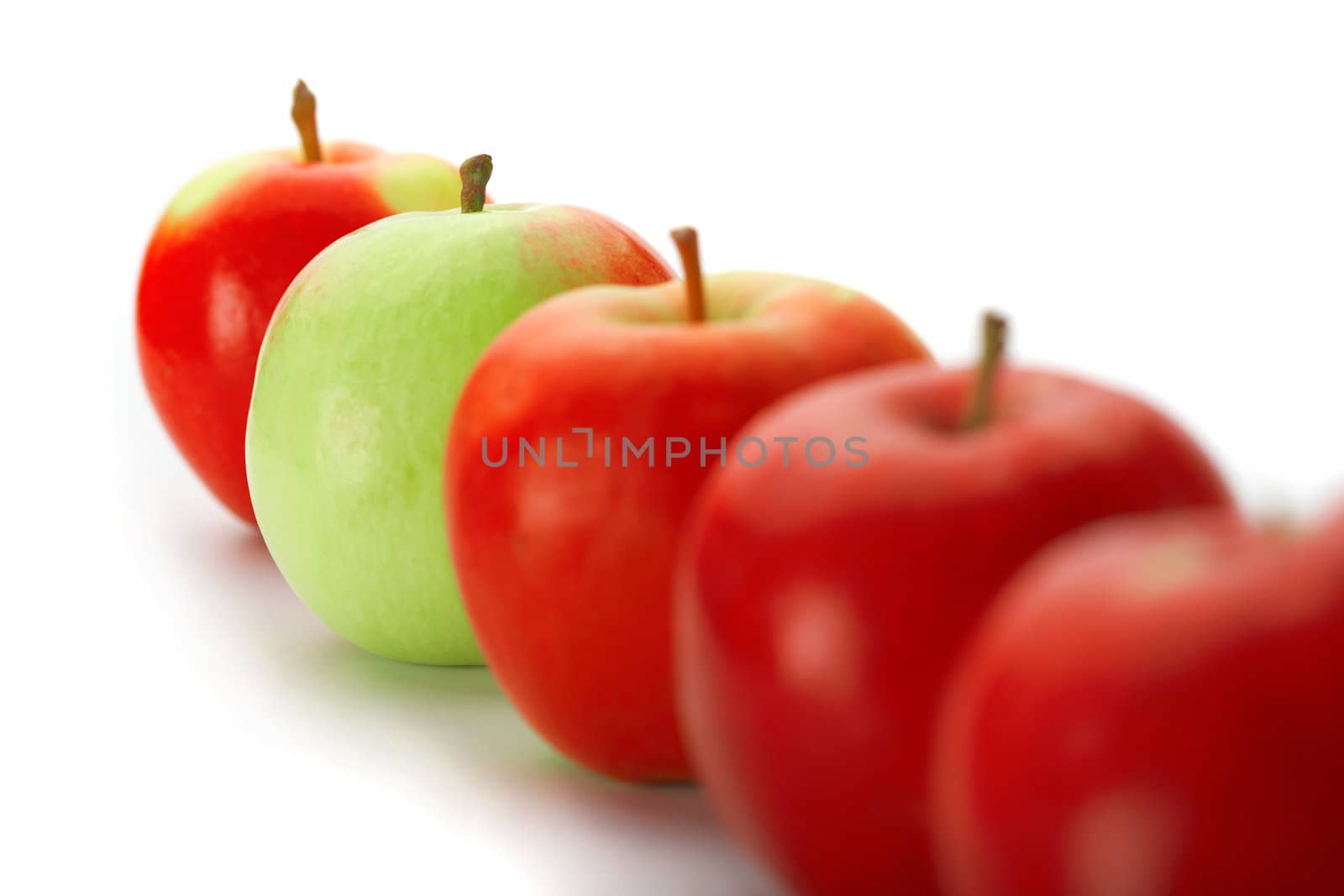 Group of red apples with one green one by romanshyshak