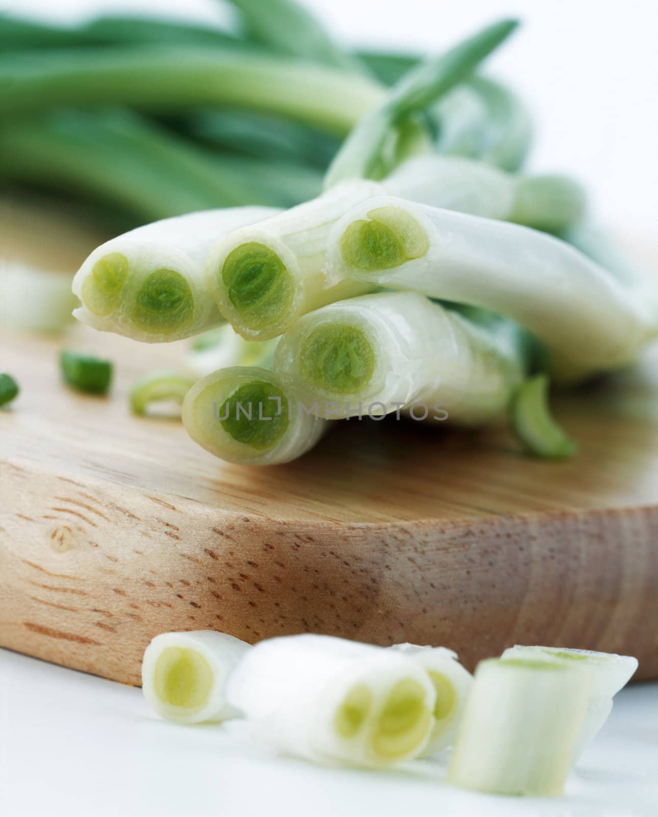 Bunch of green onions on a cutting board