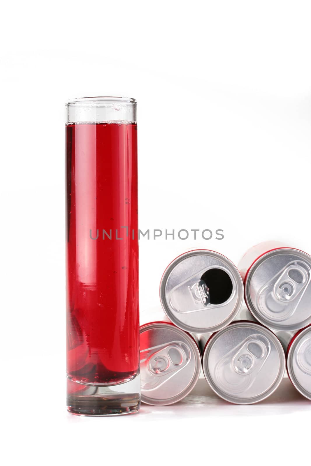 The high glass narrow glass with a drink of red colour and containers from a tin in which is stored this drink.