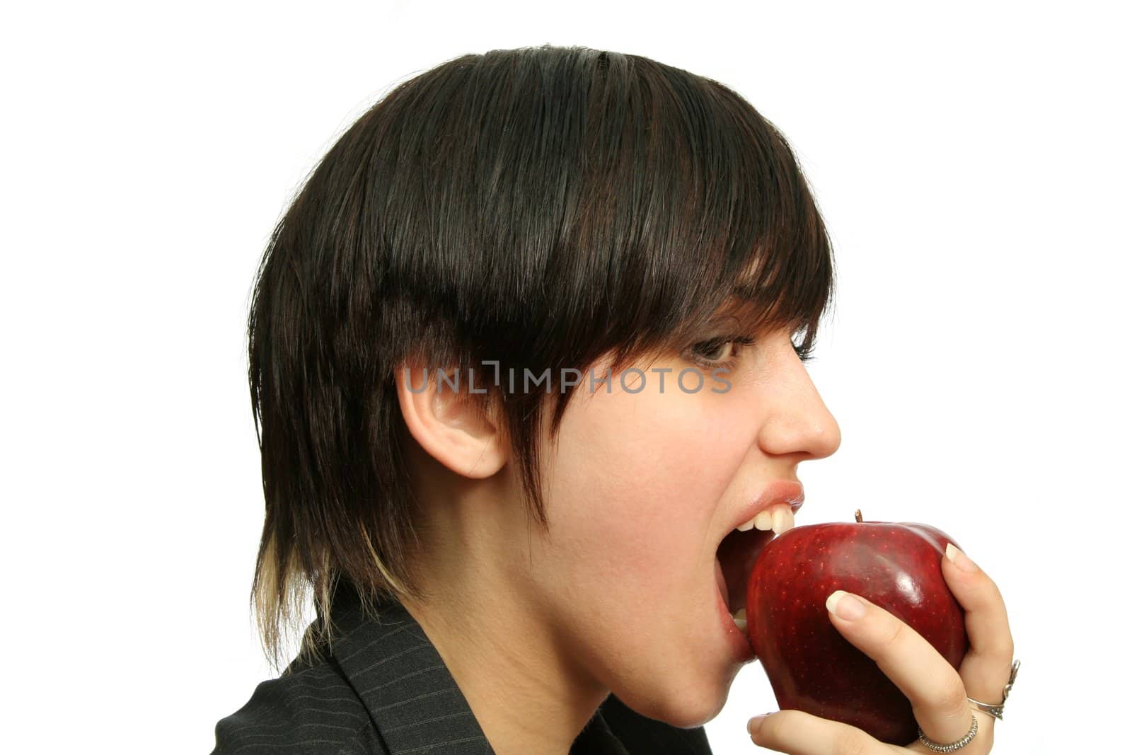 The young girl with a red apple, isolated on white