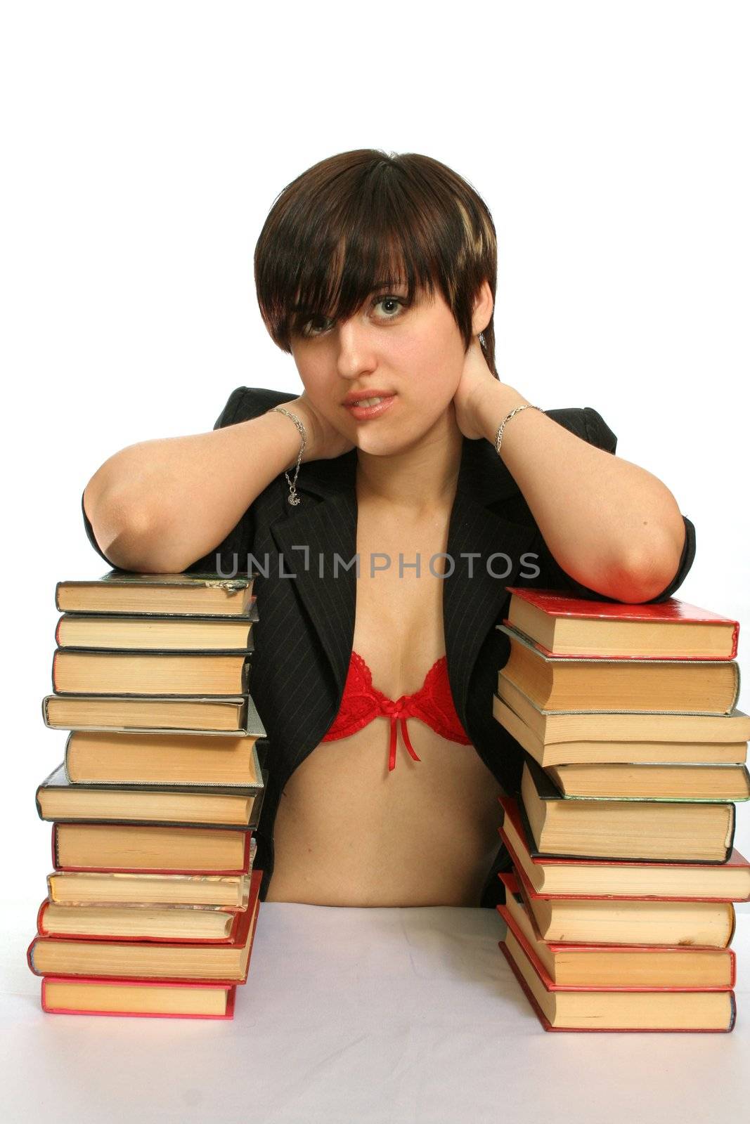 The young smiling girl with books, isolated on white