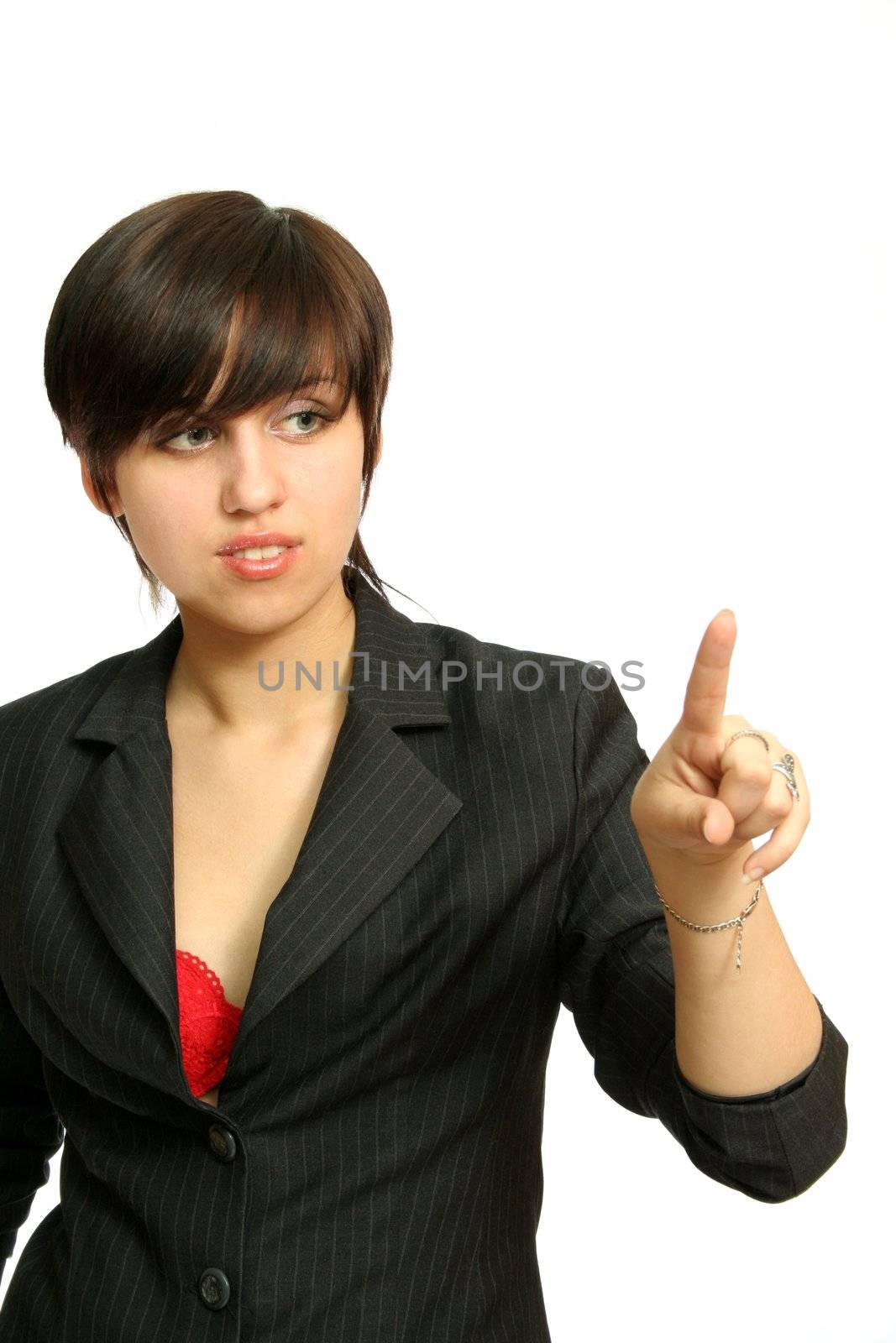 The young girl presses something a finger, isolated on white