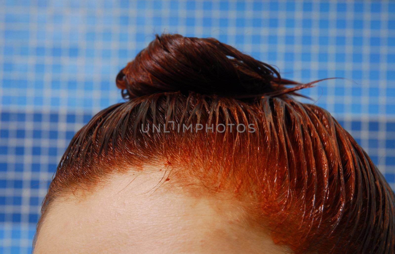 Head with dyeing wet red hair