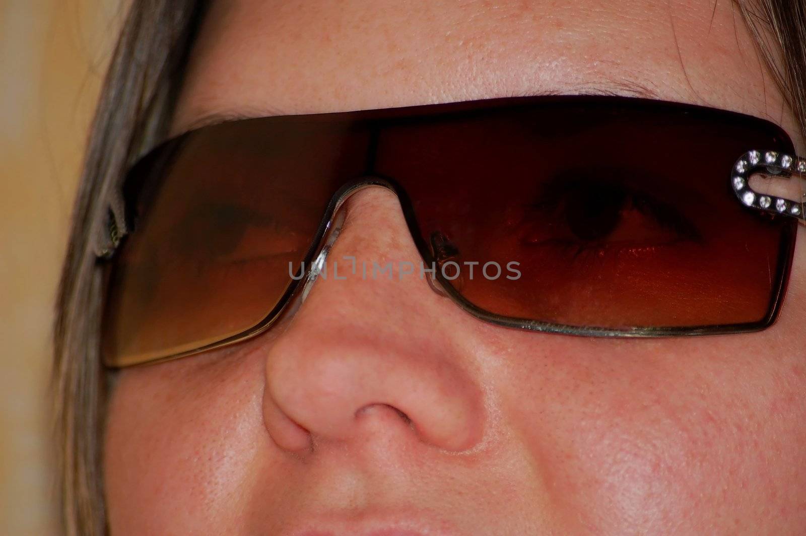 portrait of woman with brown sunglasses