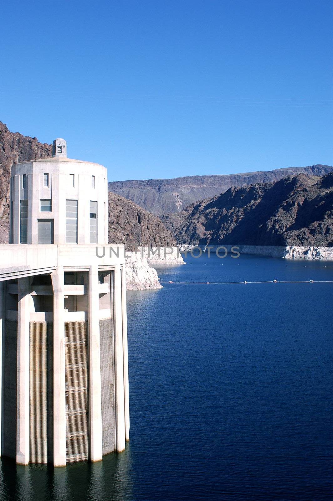 View of Lake Mead from the bridge across the Hoover Damn, between Nevada and Arizona time zones - blue water and blue sky
