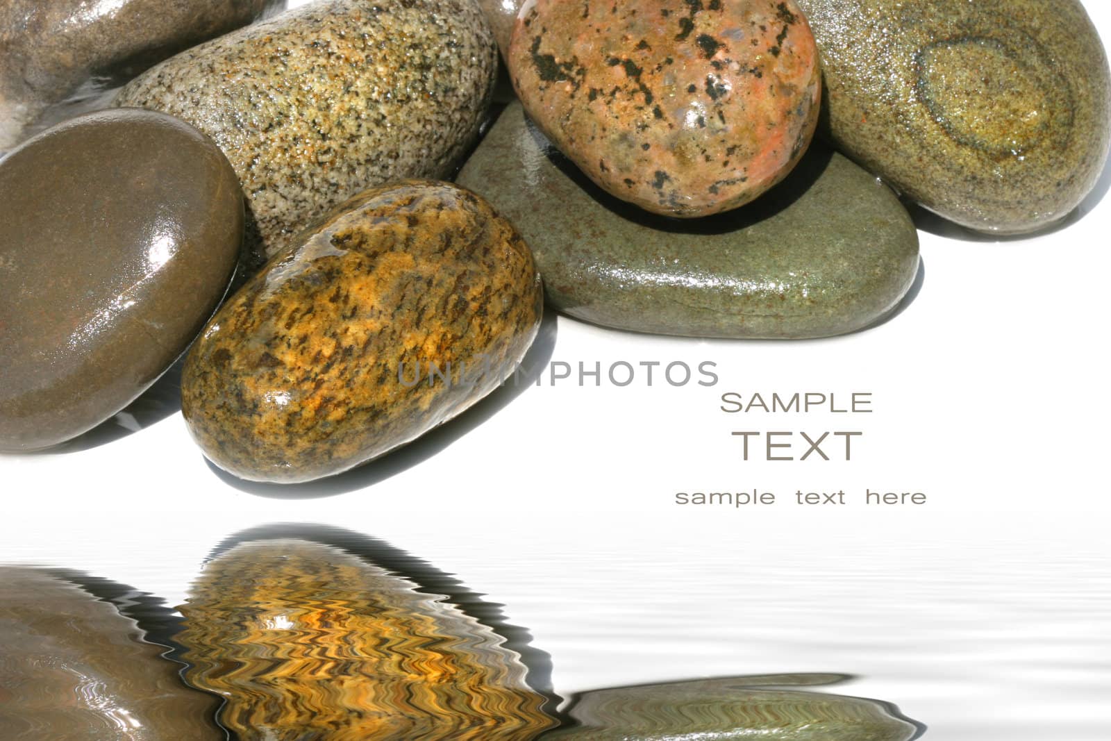 Wet rocks against white background