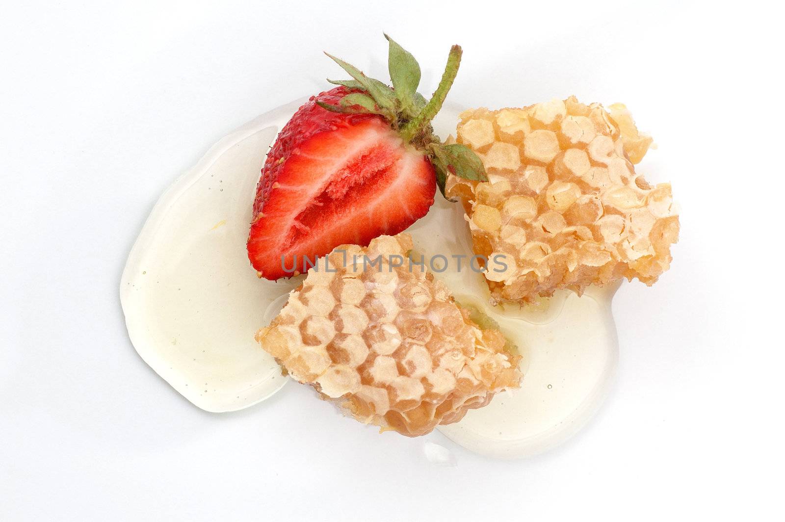 Piece of honey and strawberry isolated