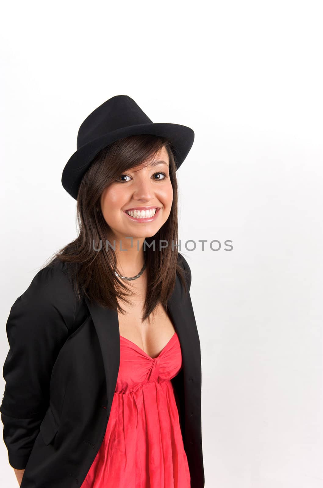 Pretty young woman posing in a studio with a nice black clothes