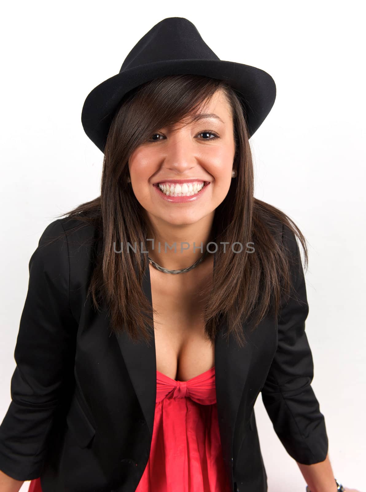 Pretty young woman posing in a studio with a nice black clothes