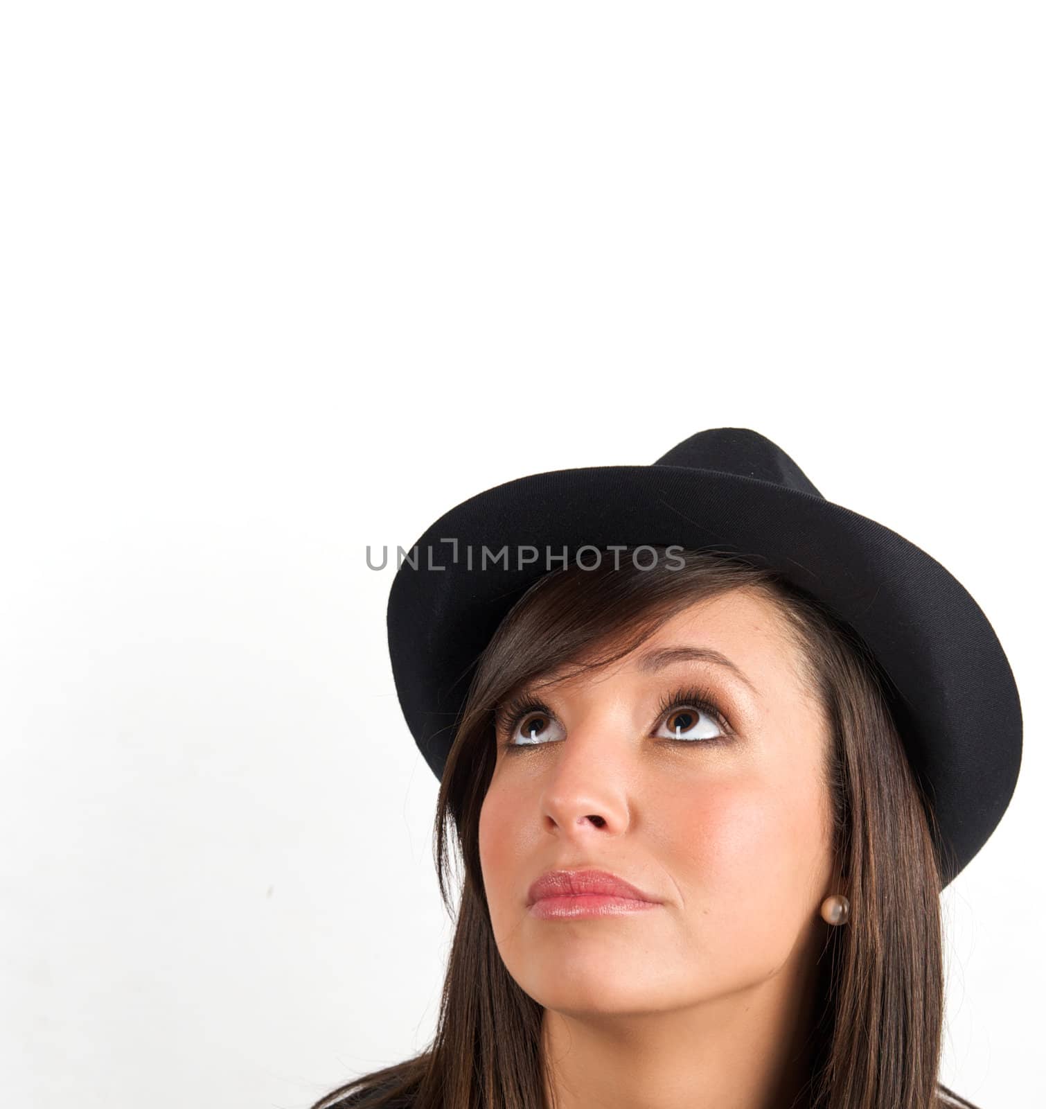 Pretty young woman posing in a studio with a nice black clothes