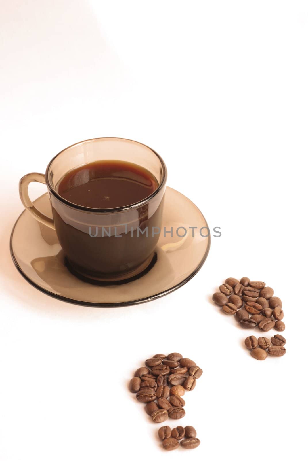 Cup of coffee and footprint from coffee beans 