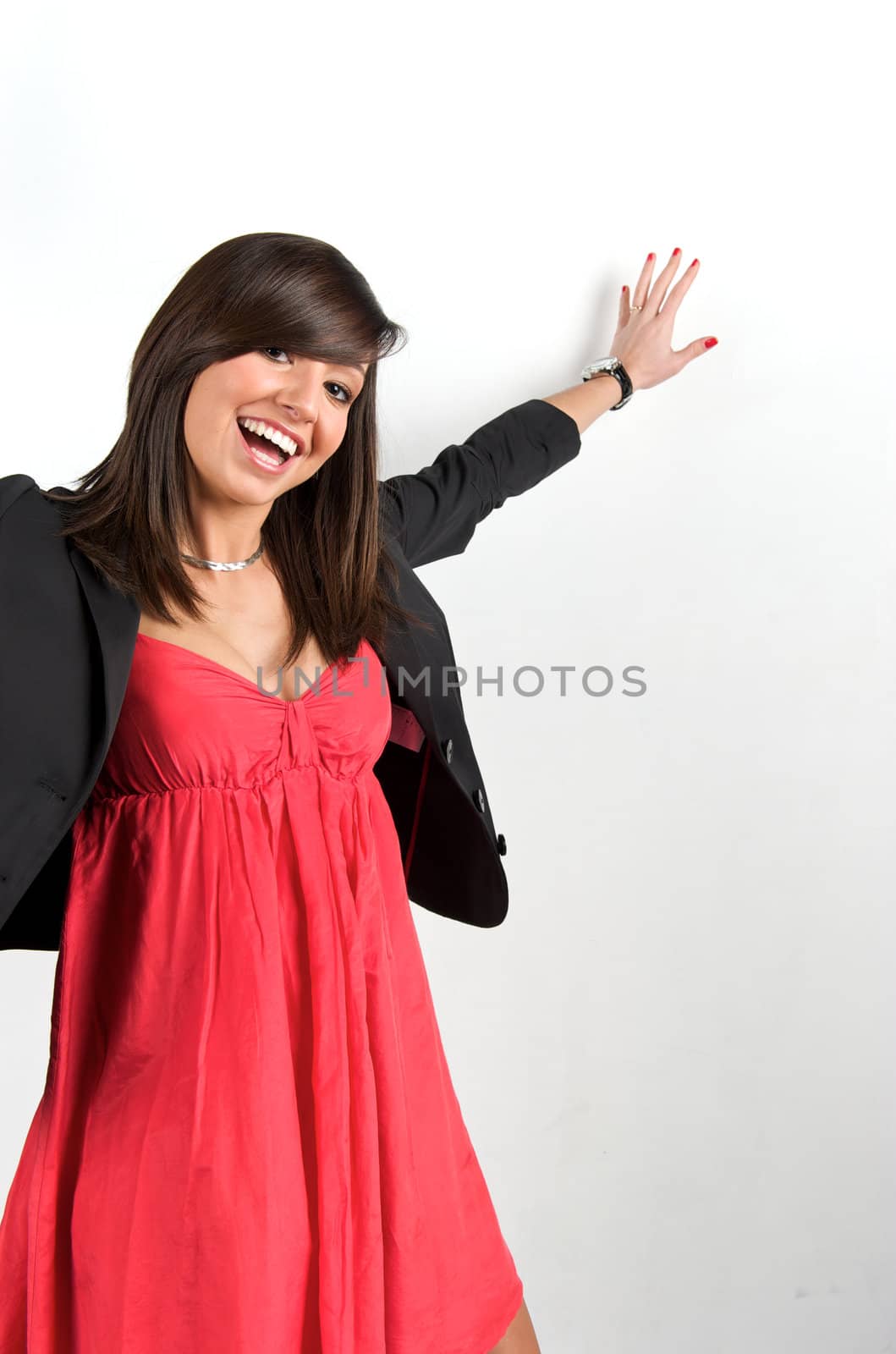 Pretty young woman posing in a studio with a nice black clothes