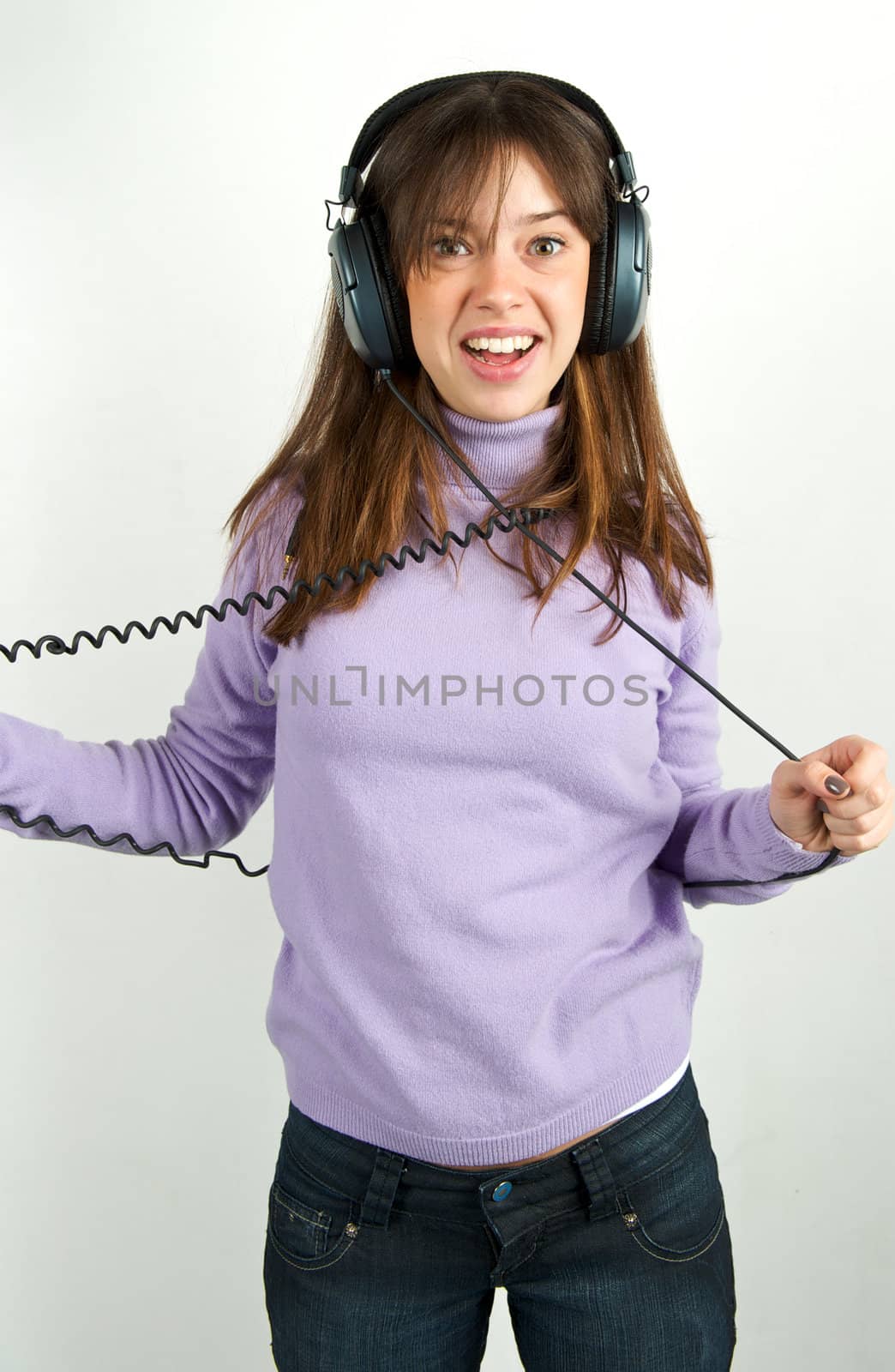 Pretty woman listening to music with headphone