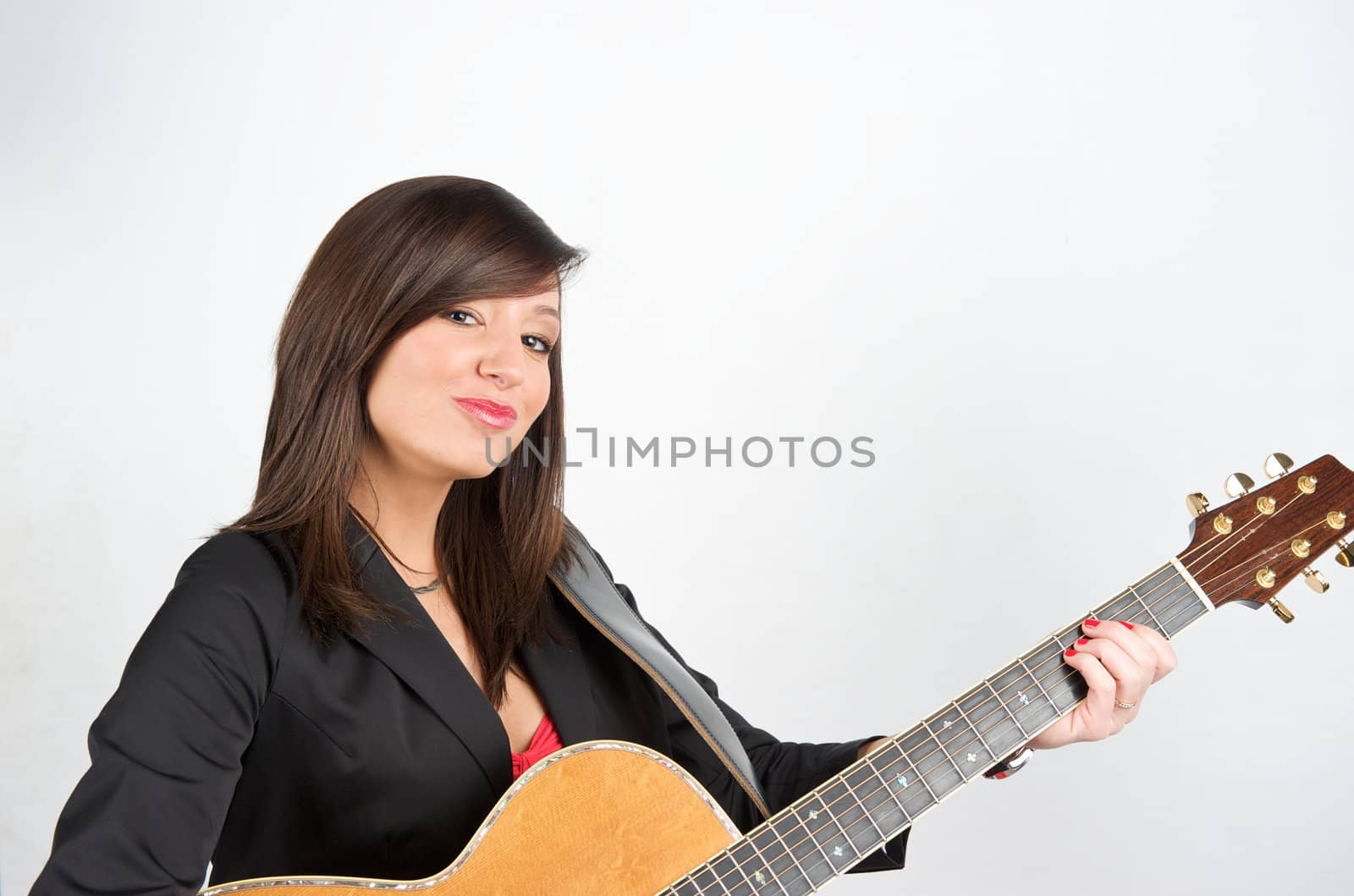 Pretty woman playing with guitar