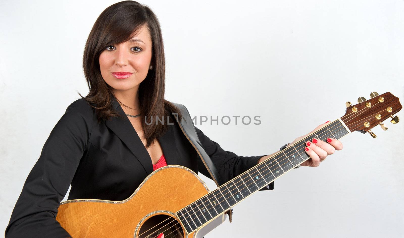 Pretty woman playing with guitar