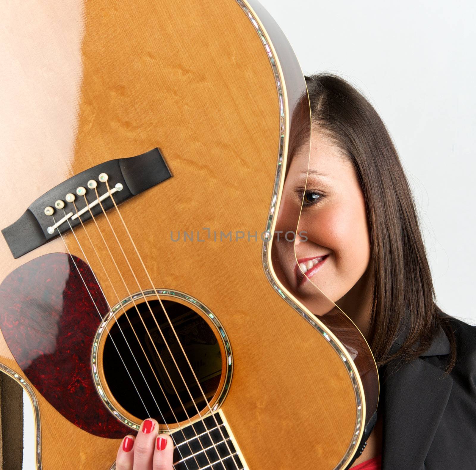 Pretty woman playing with guitar
