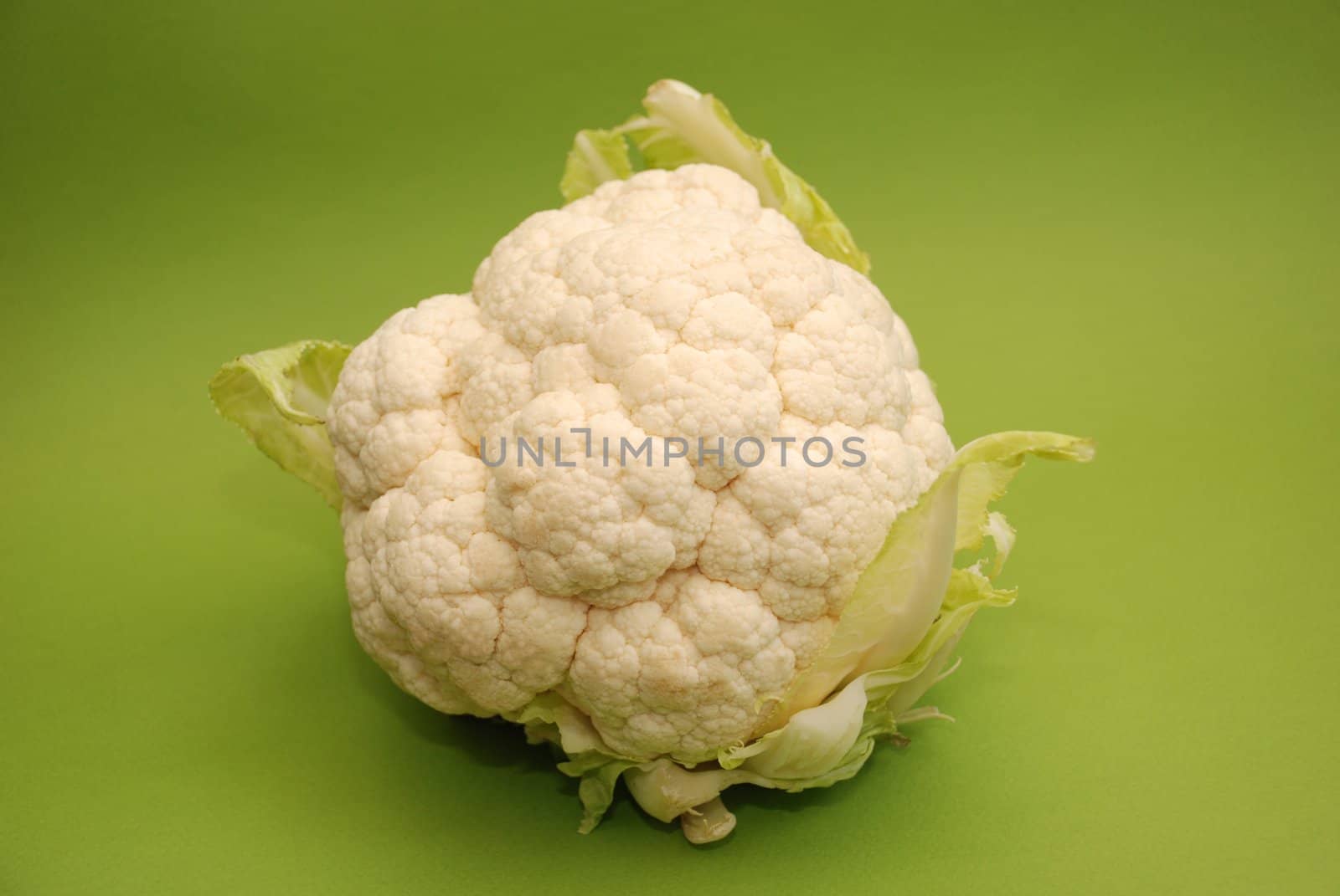 Cauliflower on green background