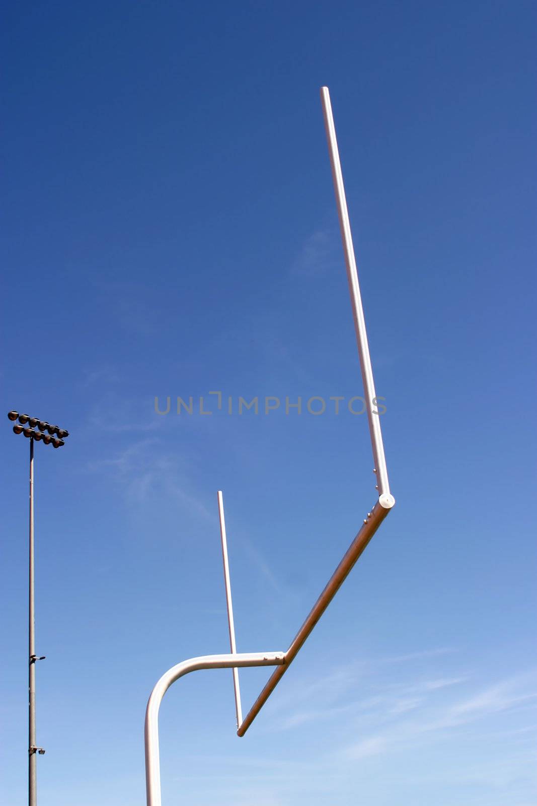 American football goal with the sky as a background.