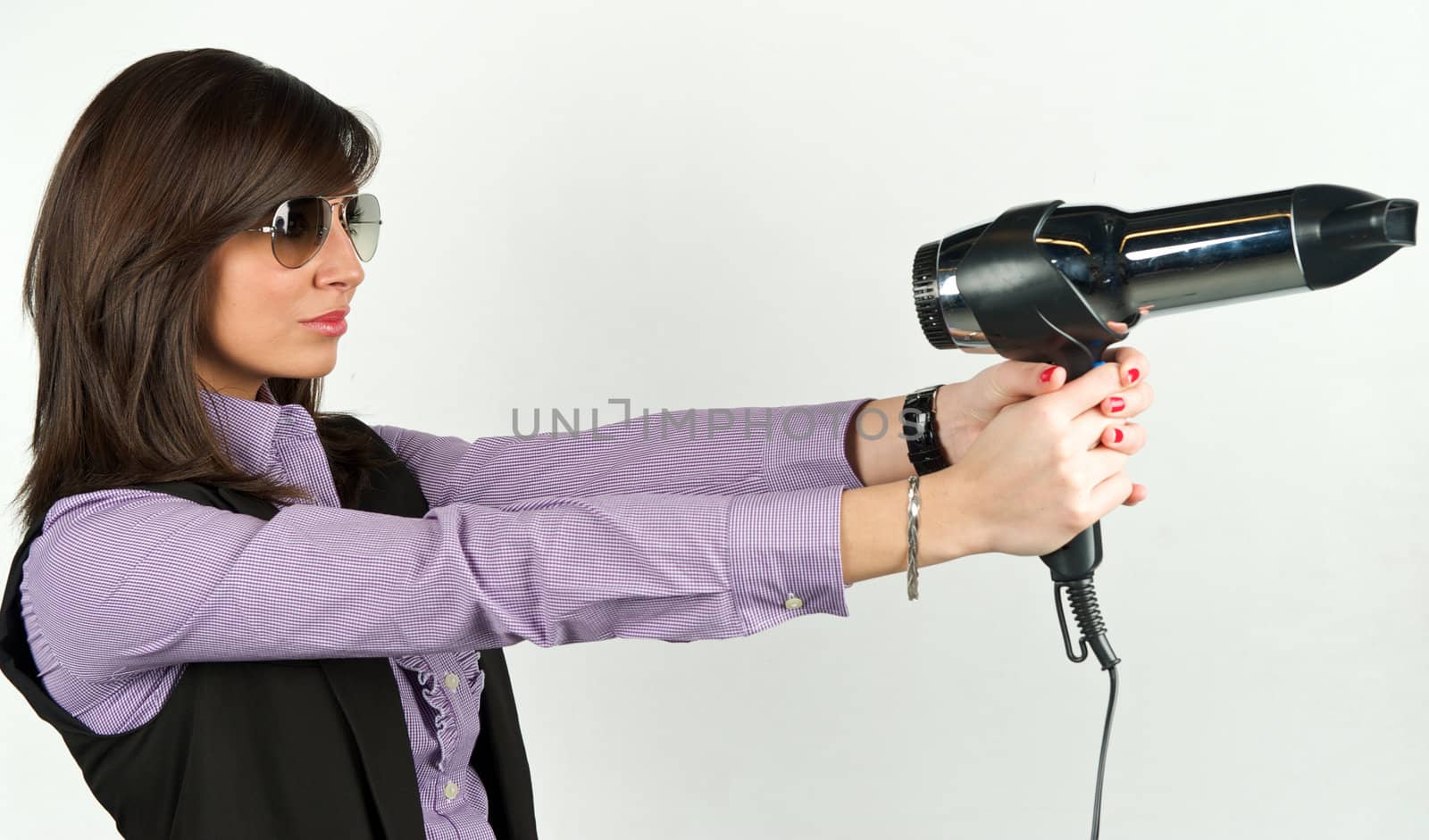 Young attractive woman with hairdryer 