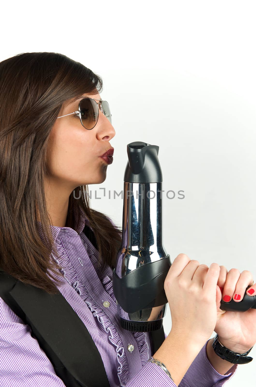 Young attractive woman with hairdryer 