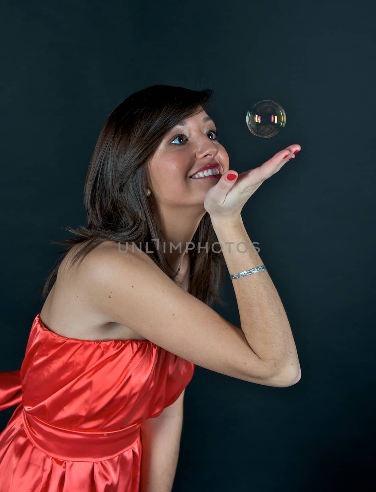 Pretty young woman posing with some bubbles around her