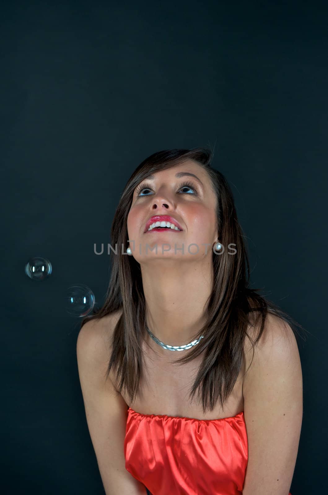 Pretty woman in a studio with bubbles by swimnews