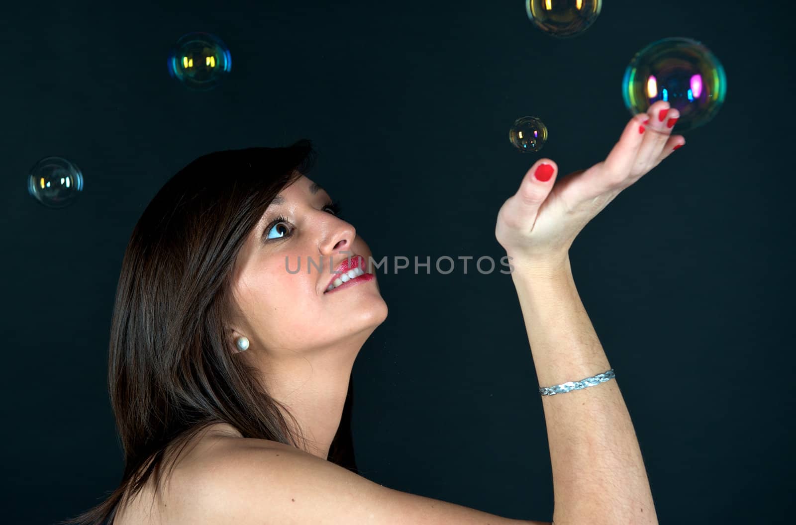 Pretty woman in a studio with bubbles by swimnews