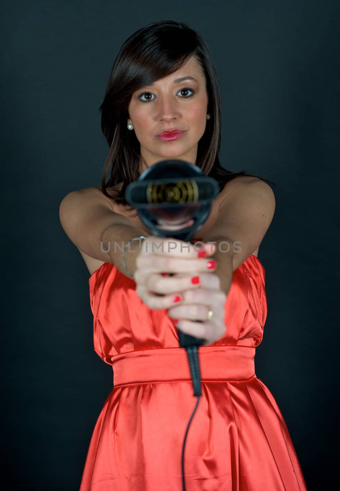 Young attractive woman with hairdryer 