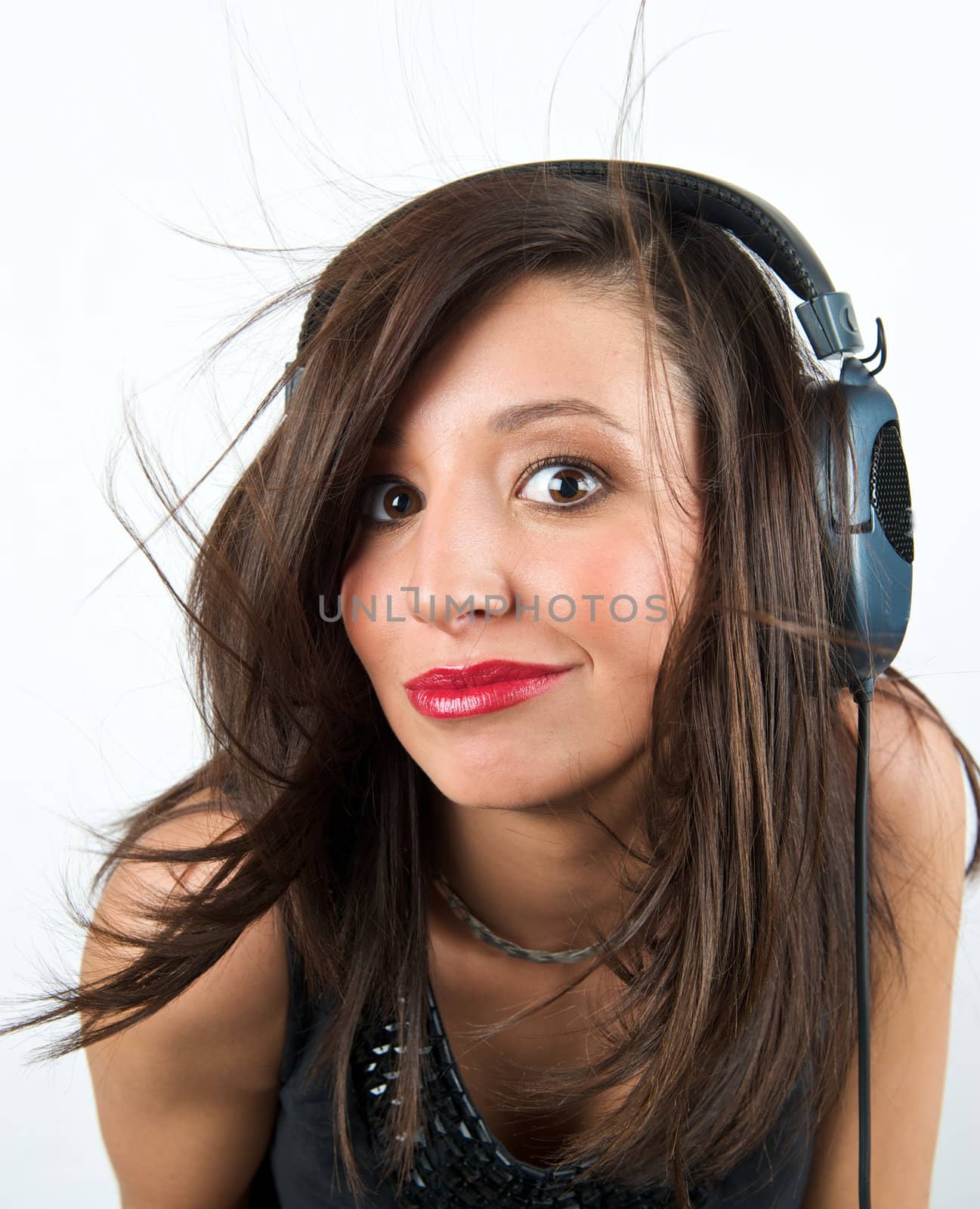 Pretty woman listening to music with headphone