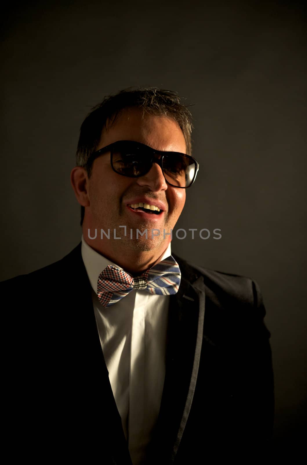 Portrait of young male adult wearing suit