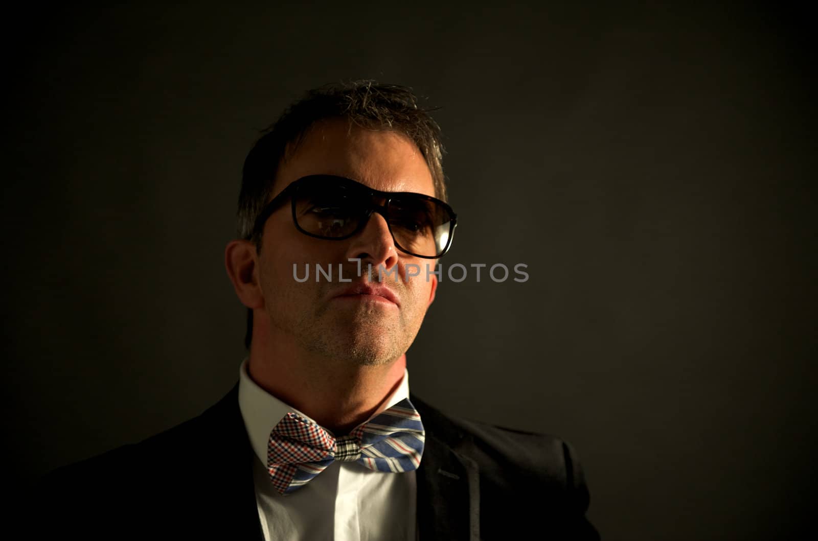 Portrait of young male adult wearing suit