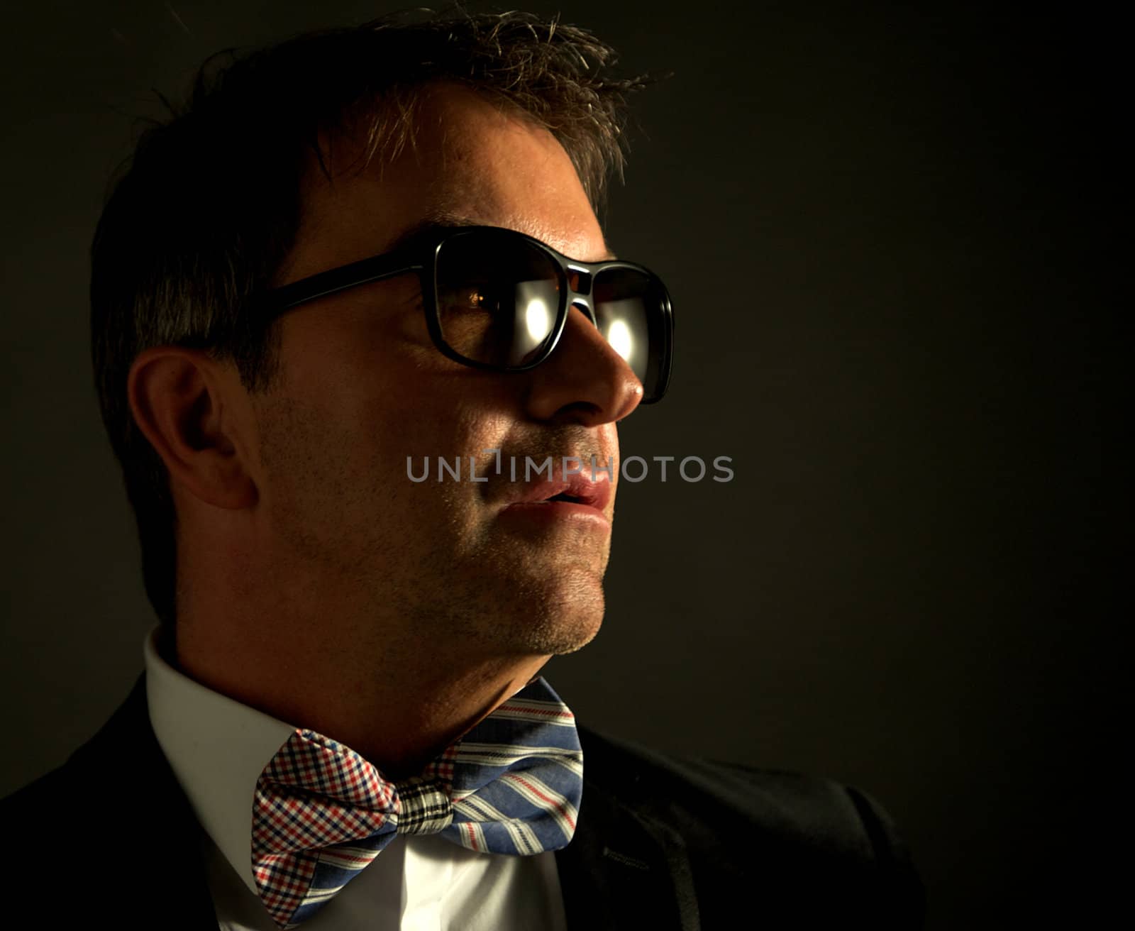 Portrait of young male adult wearing suit