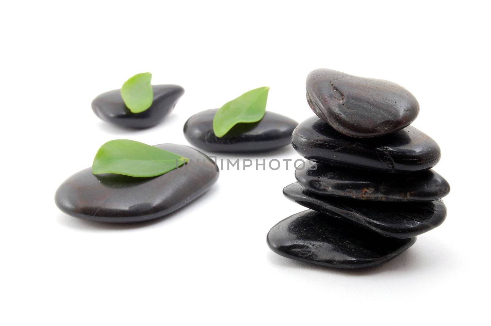 black stones in balance isolated on white background