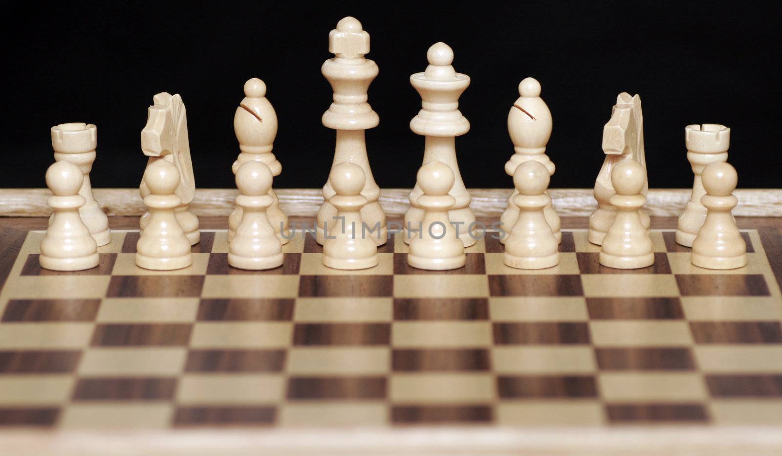 White Chess Pieces On Chessboard,Focus On Back Row