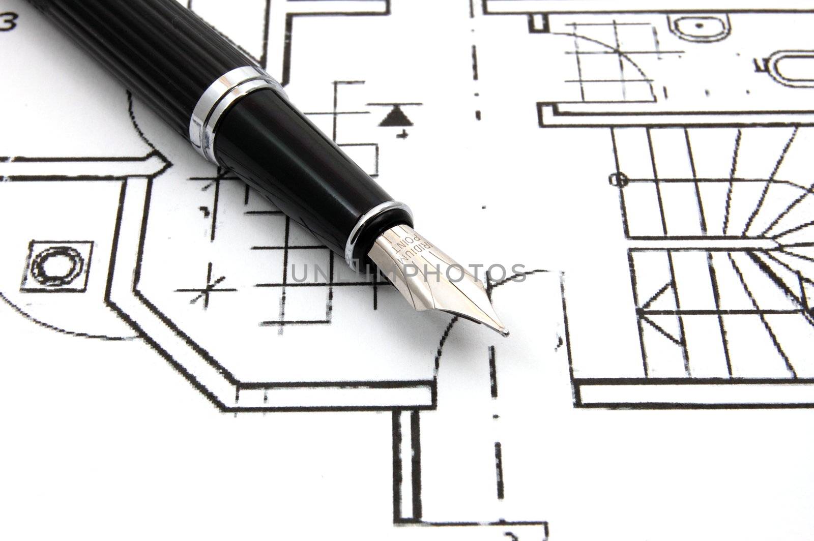 black fountain pen on business stock chart