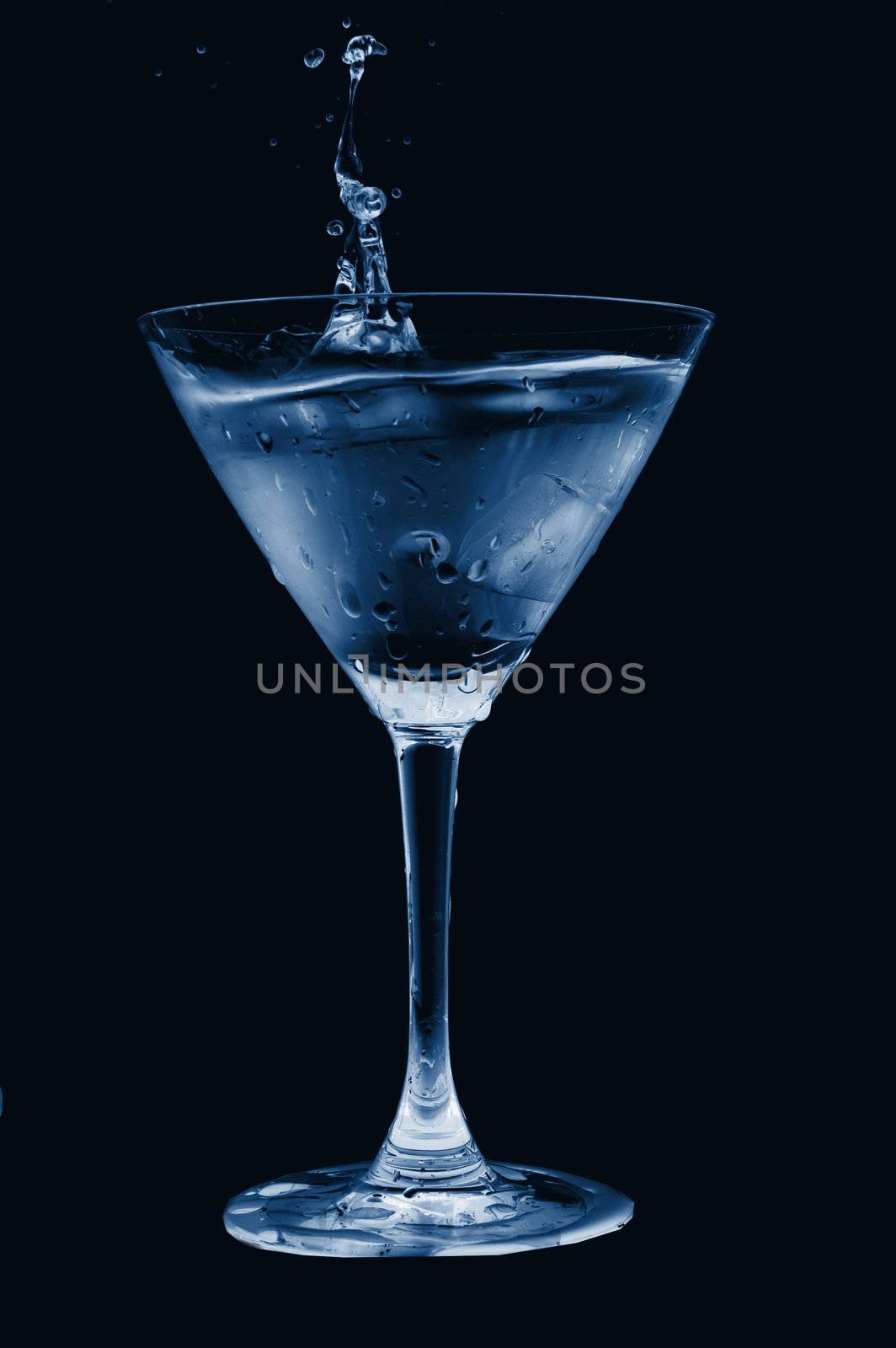 glass of cool splashing water isolated on white background