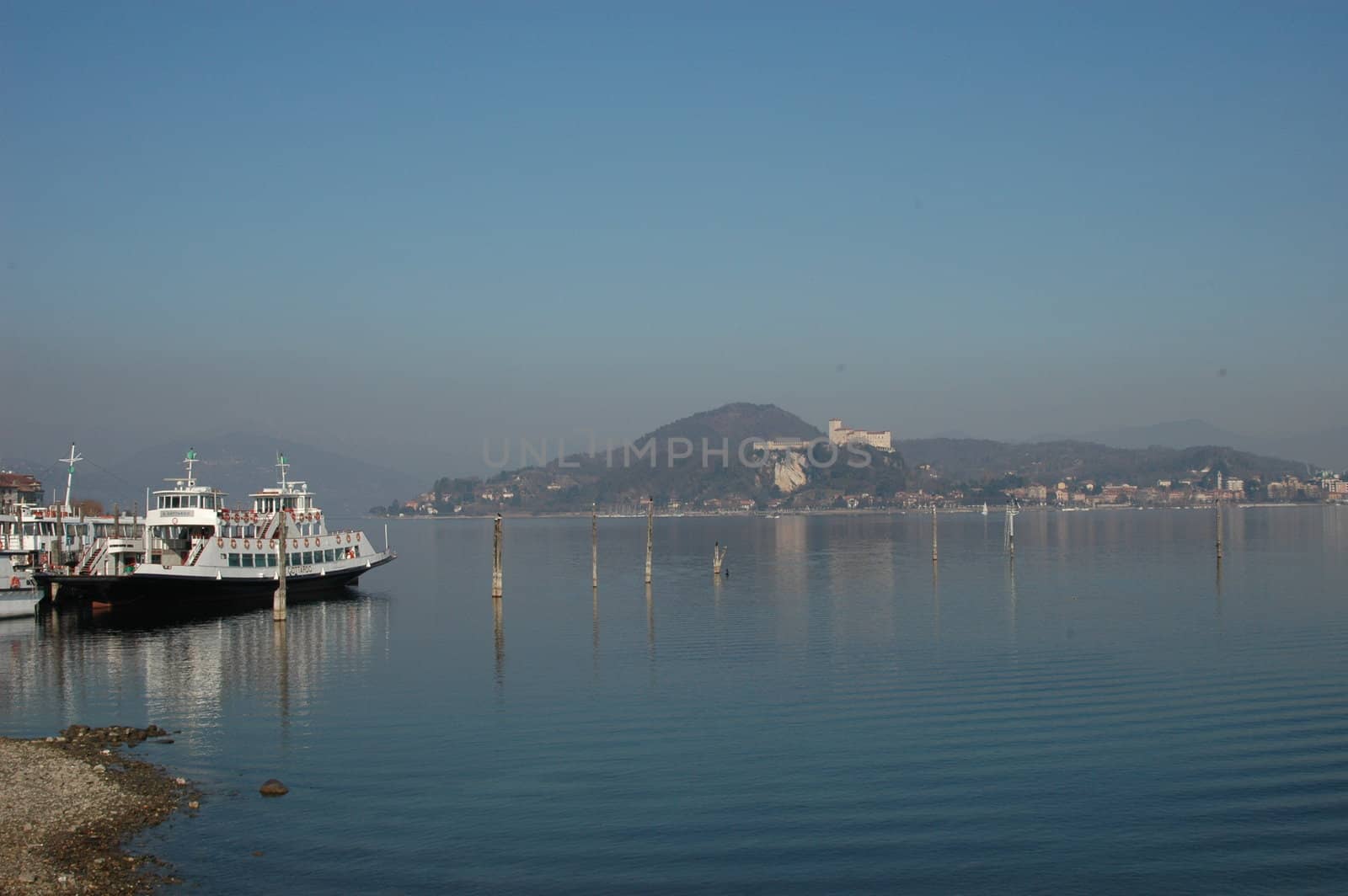 view of la rocca di angera from arona beach