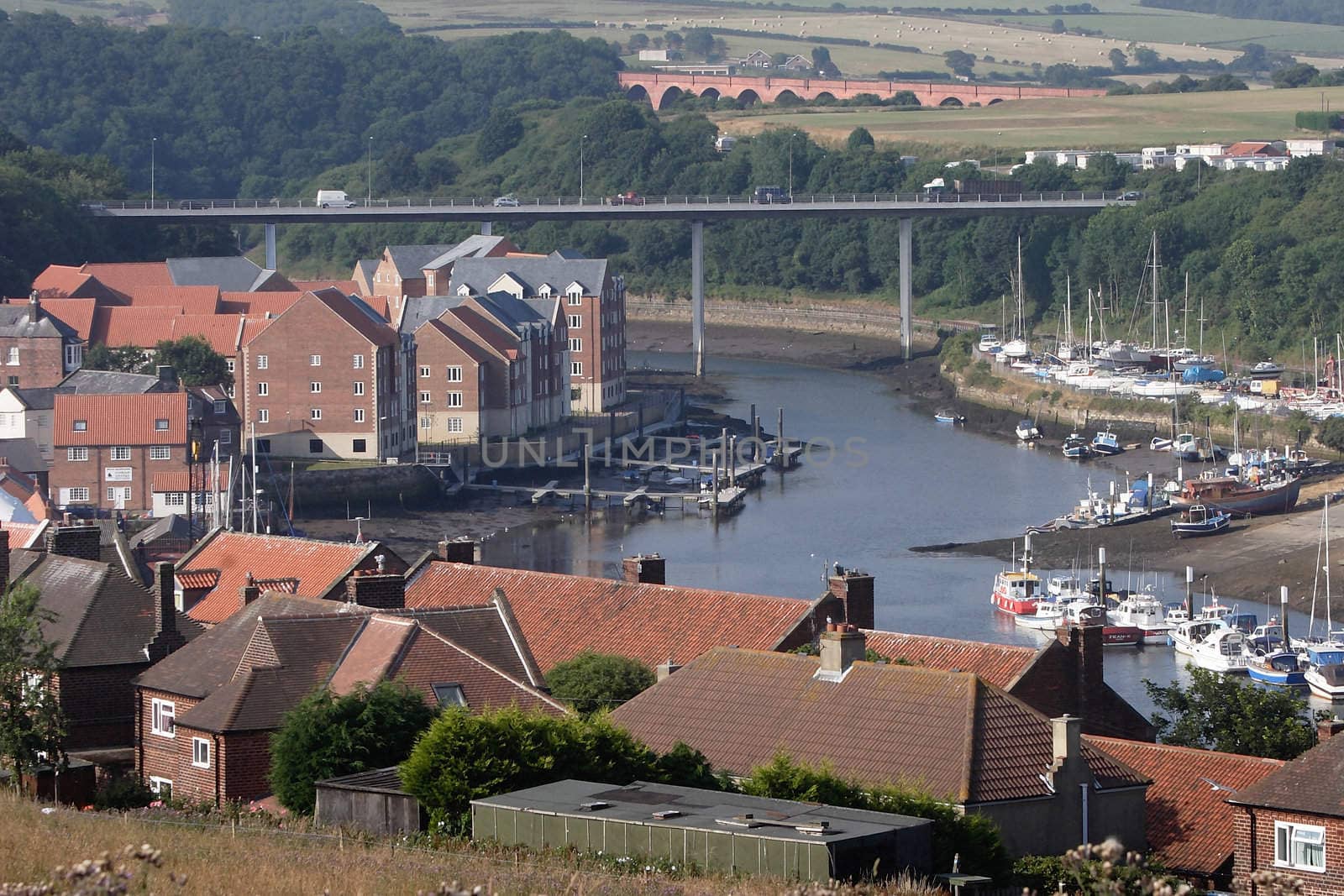 Looking inland at Whitby, North Yorkshire, England, showing the road and rail bridges.