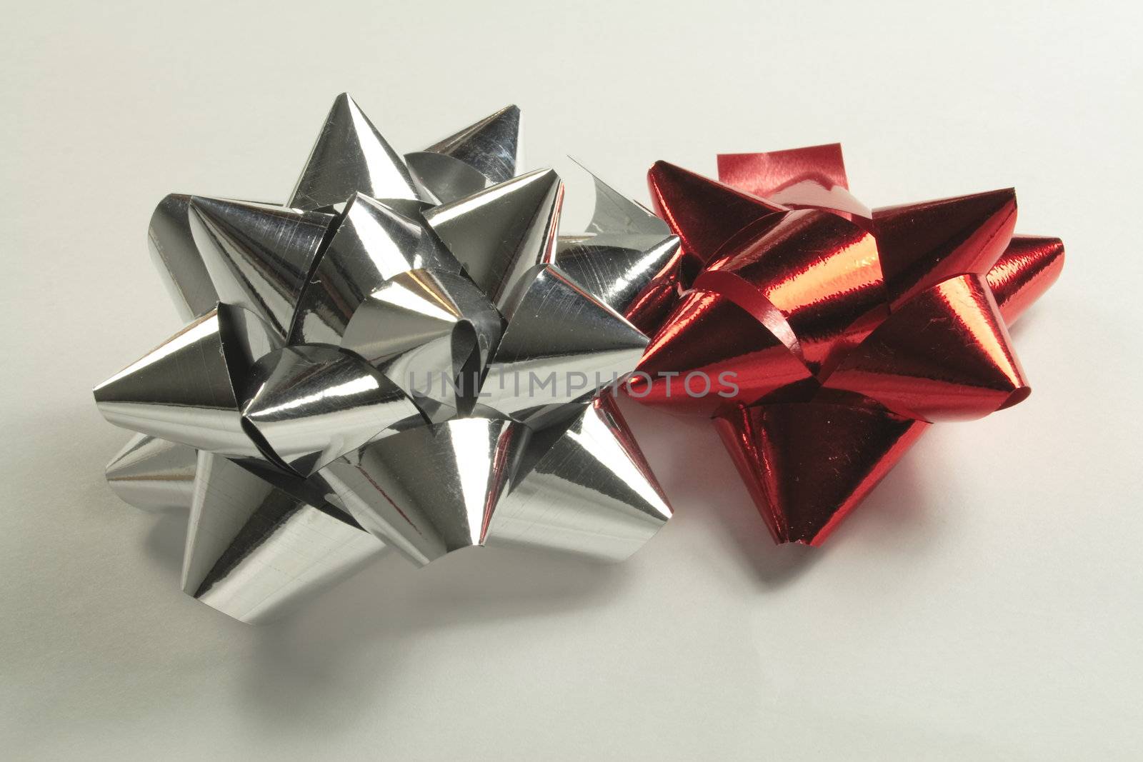 silver and red foil bows by leafy