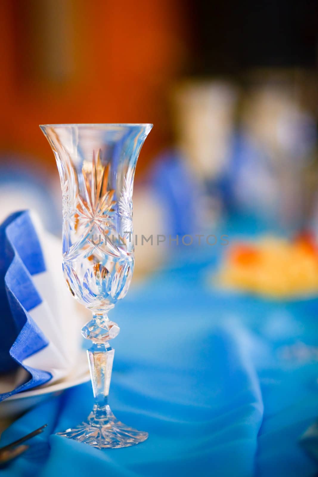 Wedding table set with glasses and small wrapped present