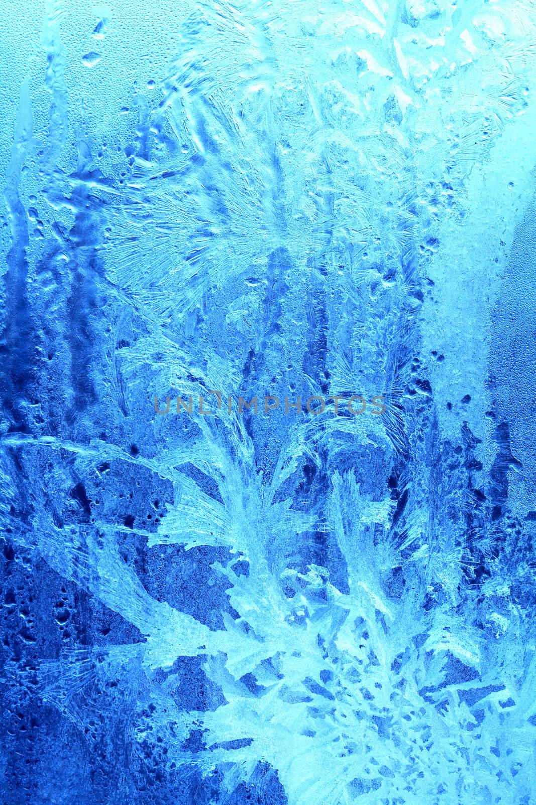 Nice blue pattern made from ice lying on window glass