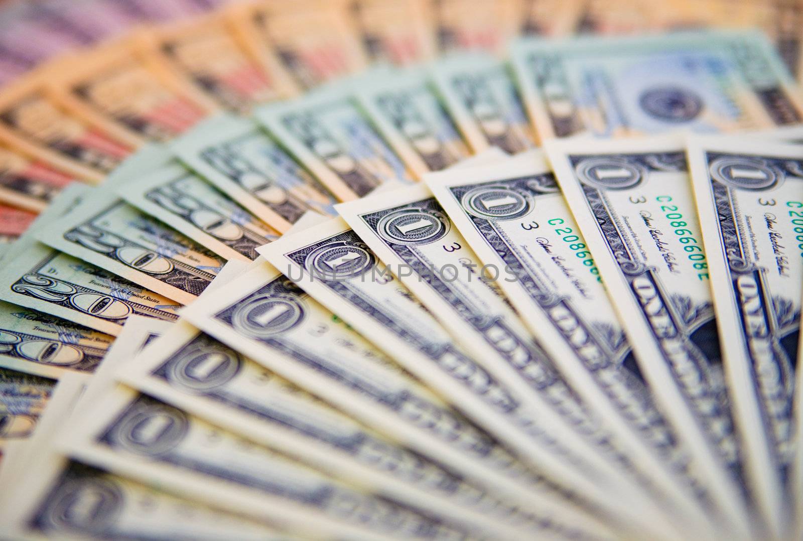 US banknotes on a fan of high-denomination european euro notes