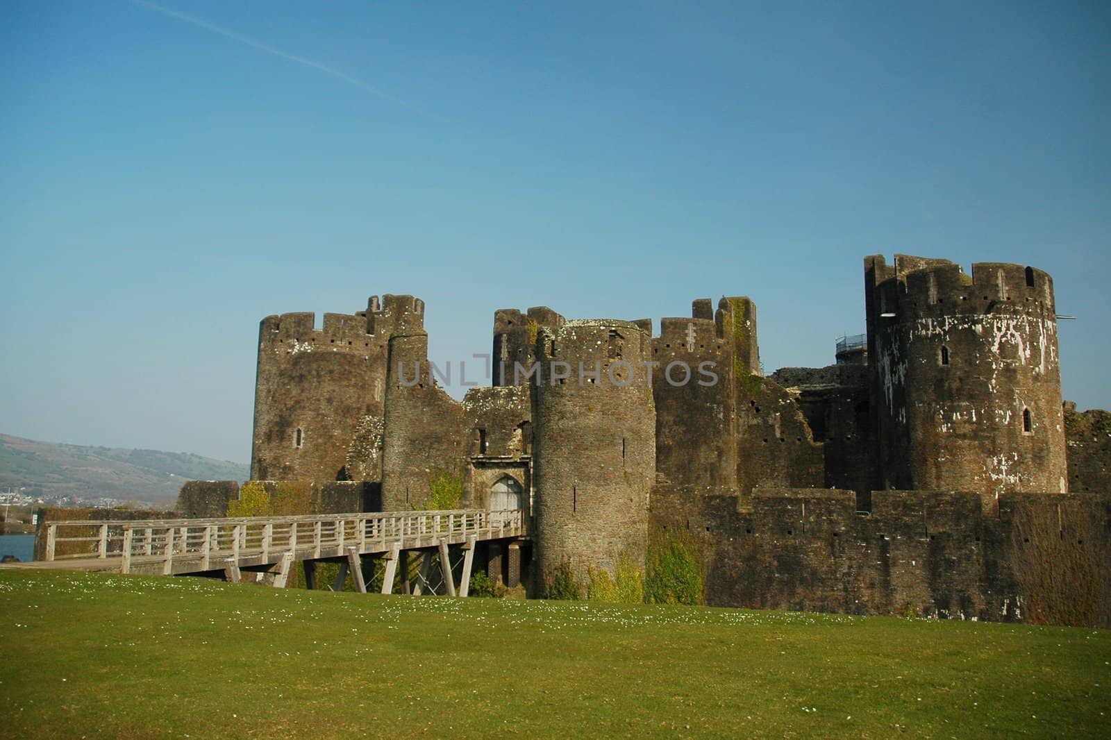 caerphilly castle with grass, horizontally framed shot