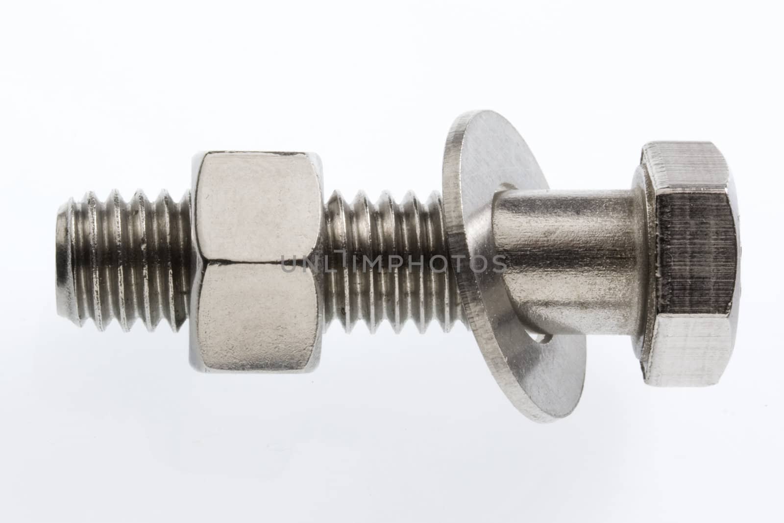 macro of a big stainless steel bolt with a nut and washer on white