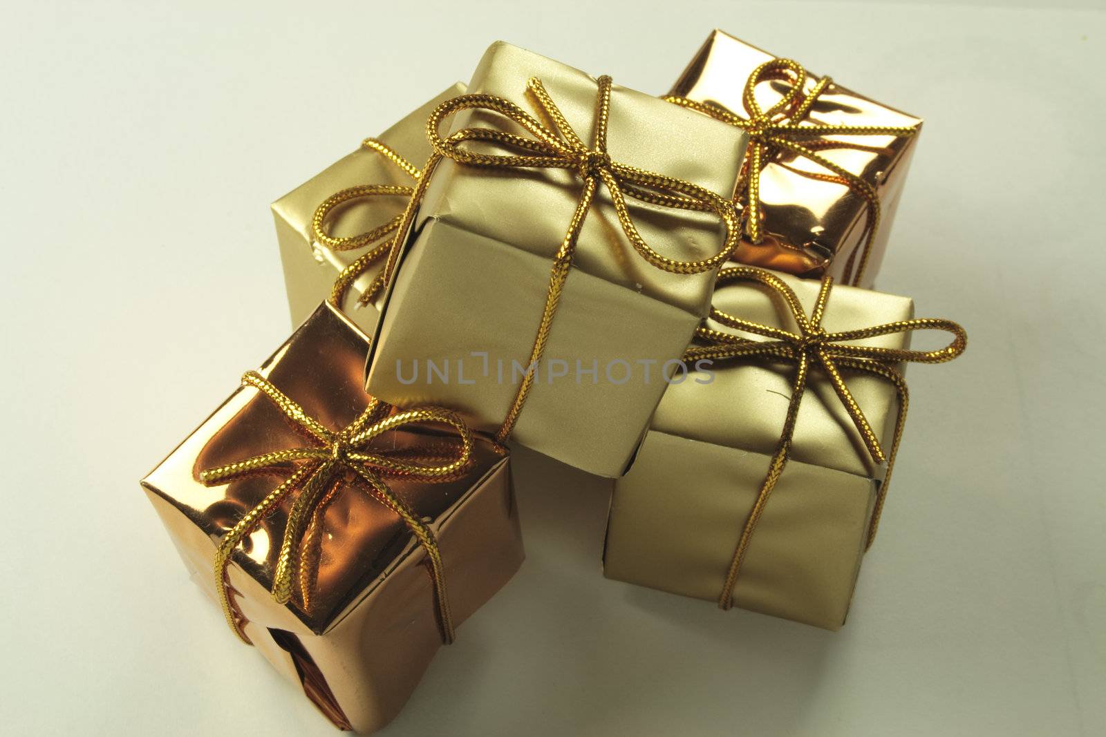gold present decorations by leafy